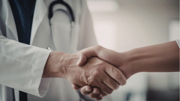 doctor shaking hands with nurse practitioner and creating referral network